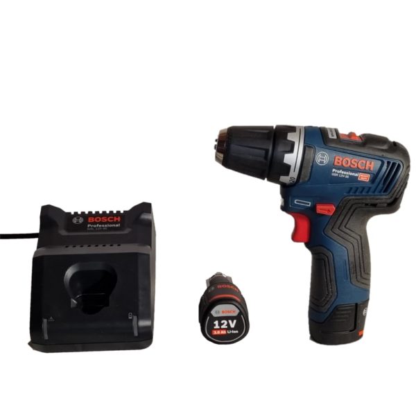 photo d'un kit à percer incluant une perceuse 12V, son chargeur et une batterie additionnelle